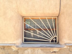 A window on the side of the Chimayo Sanctuario