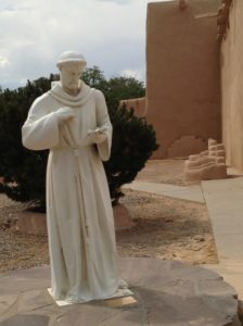 One of my favorite photos: St. Francis checking for text messages from the Pope.